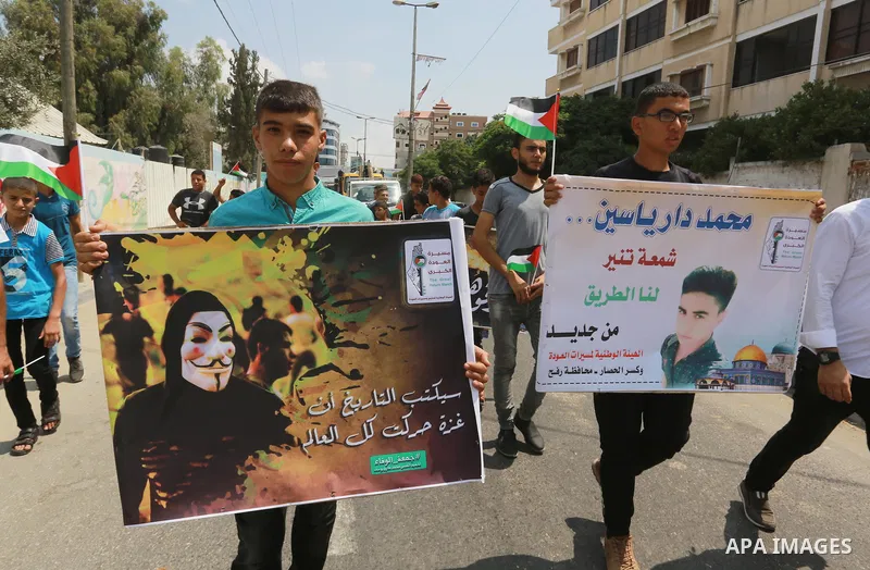 Palestinian scouts take part in a march "The Great Return March", in Rafah in the southern of Gaza strip, on Aug. 02, 2018. Photo by Abed Rahim Khatib