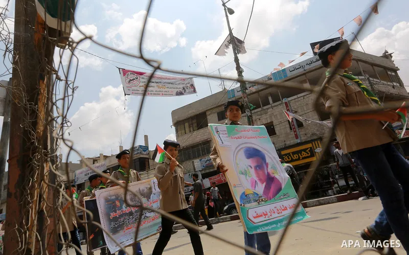 Palestinian scouts take part in a march "The Great Return March", in Rafah in the southern of Gaza strip, on Aug. 02, 2018. Photo by Abed Rahim Khatib