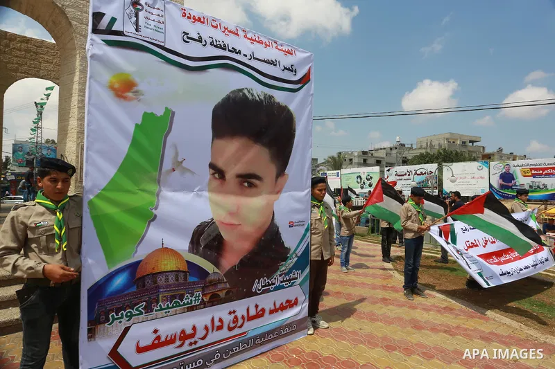 Palestinian scouts take part in a march "The Great Return March", in Rafah in the southern of Gaza strip, on Aug. 02, 2018. Photo by Abed Rahim Khatib