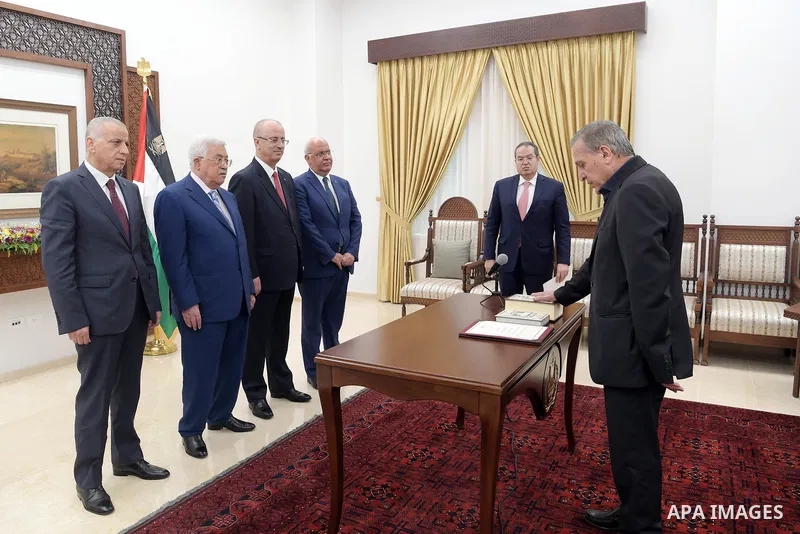 Mr. Nabil Abu Rudeineh sworns in as Deputy Prime Minister and Minister of Information in the Government in front of Palestinian President Mahmoud Abbas, at his headquarters in the West bank city of Ramallah on Aug. 02, 2...