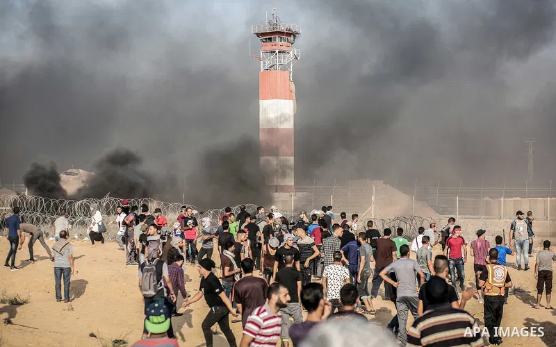 Palestinian protesters gather during clashes with Israeli troops in tents protest where Palestinian demand the right to return to their homeland at the Israel-Gaza border, in Rafah, in the southern Gaza Strip on Aug. 03,...