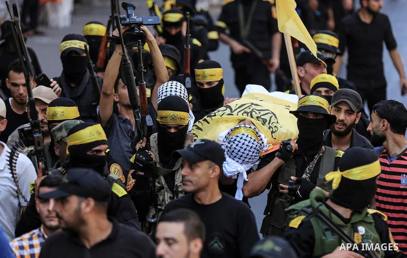 Mourners carry the body of Palestinian Ahmed Yaghi, 25, who was shot dead by Israeli troops during clashes along the border the previous day, during his funeral in Gaza city on Aug. 04, 2018. Photo by Dawoud Abo Alkas