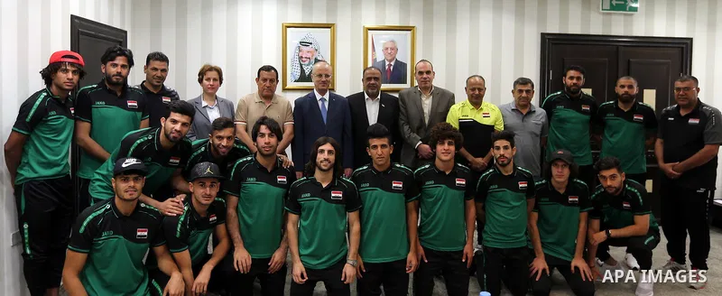 Palestinian Prime Minister Rami Hamdallah, meets with the Iraqi team for football in the West Bank city of Ramallah on August 5, 2018. Photo by Prime Minister Office