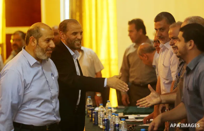 Palestinian Hamas officials Husam Badran and Khalil al-Hayya arrive for a meeting with Palestinian factions in Gaza City on August 5, 2018. Photo by Ashraf Amra