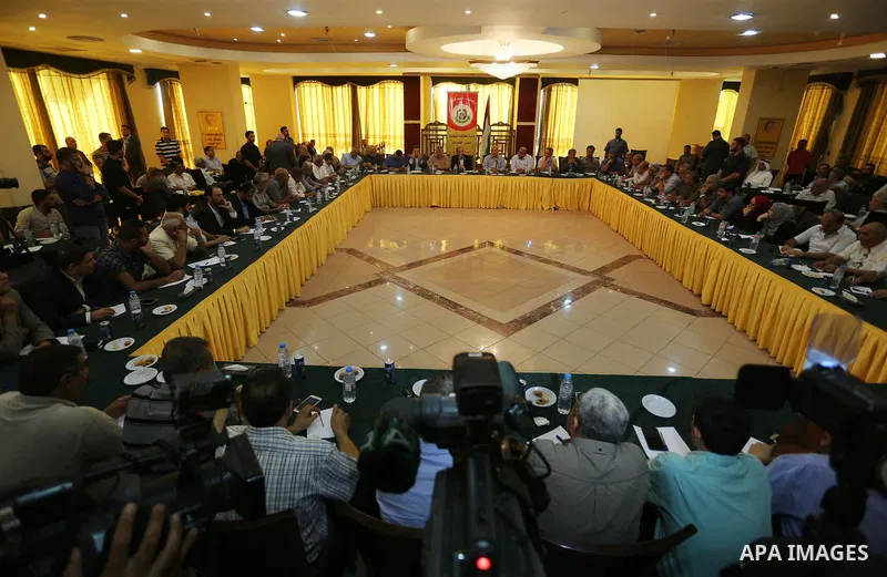 Palestinian Hamas official Husam Badran attends a meeting with Palestinian factions in Gaza City on August 5, 2018. Photo by Ashraf Amra