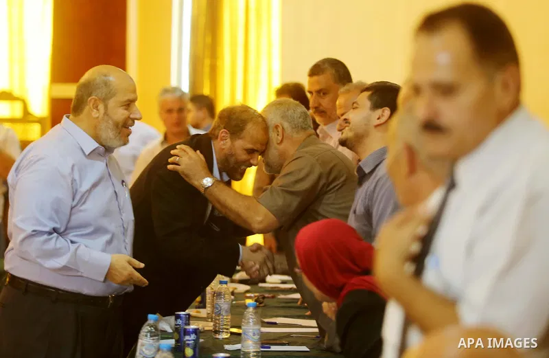 Palestinian Hamas officials Husam Badran and Khalil al-Hayya arrive for a meeting with Palestinian factions in Gaza City on August 5, 2018. Photo by Ashraf Amra