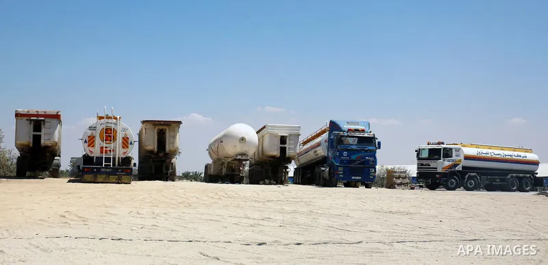 Trucks loaded with cooking gas imported from Egypt are seen at a gas station in Rafah, in the southern Gaza Strip August 6, 2018. Egypt has allowed domestic gas deliveries into the blockaded Gaza Strip for the first time...