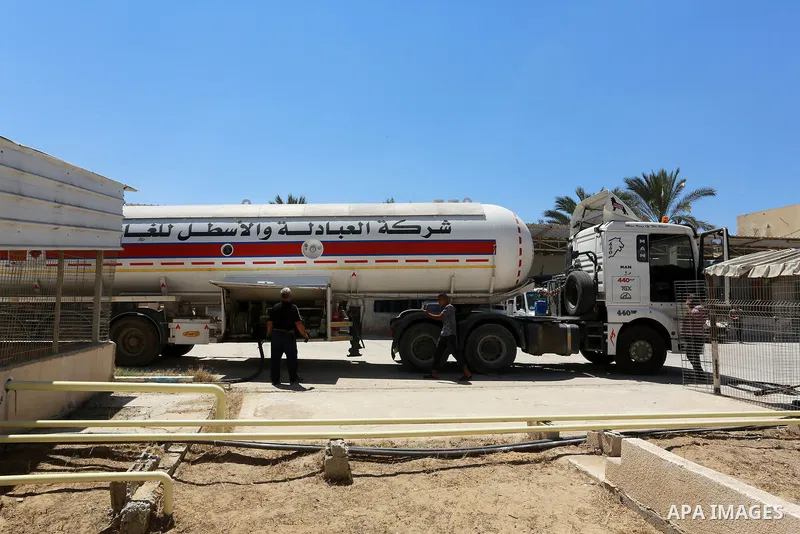 Trucks loaded with cooking gas imported from Egypt are seen at a gas station in Rafah, in the southern Gaza Strip August 6, 2018. Egypt has allowed domestic gas deliveries into the blockaded Gaza Strip for the first time...