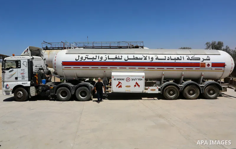 Trucks loaded with cooking gas imported from Egypt are seen at a gas station in Rafah, in the southern Gaza Strip August 6, 2018. Egypt has allowed domestic gas deliveries into the blockaded Gaza Strip for the first time...