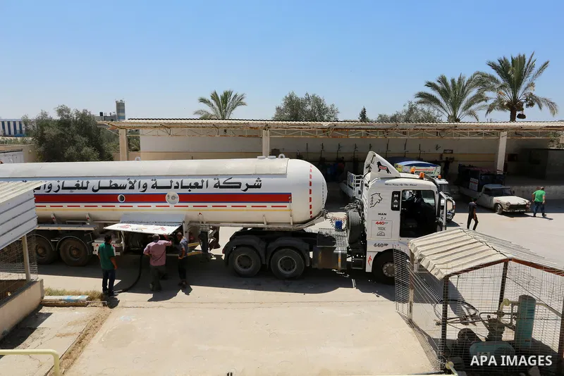 Trucks loaded with cooking gas imported from Egypt are seen at a gas station in Rafah, in the southern Gaza Strip August 6, 2018. Egypt has allowed domestic gas deliveries into the blockaded Gaza Strip for the first time...