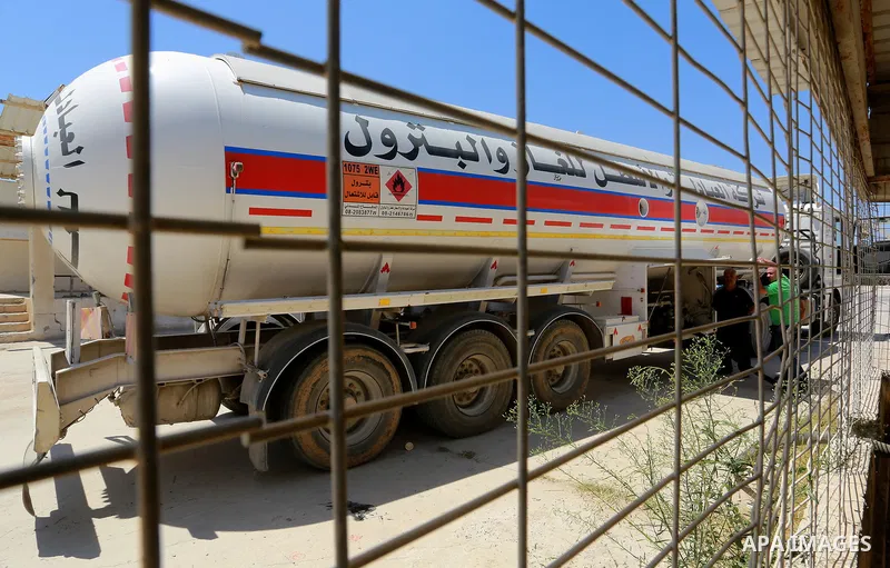 Trucks loaded with cooking gas imported from Egypt are seen at a gas station in Rafah, in the southern Gaza Strip August 6, 2018. Egypt has allowed domestic gas deliveries into the blockaded Gaza Strip for the first time...