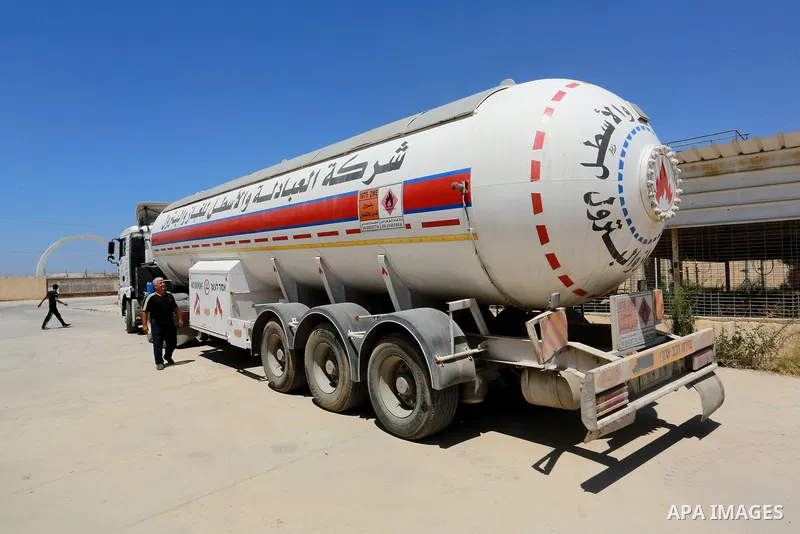 Trucks loaded with cooking gas imported from Egypt are seen at a gas station in Rafah, in the southern Gaza Strip August 6, 2018. Egypt has allowed domestic gas deliveries into the blockaded Gaza Strip for the first time...