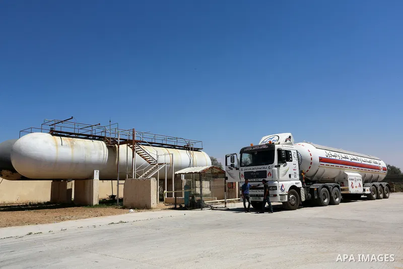 Trucks loaded with cooking gas imported from Egypt are seen at a gas station in Rafah, in the southern Gaza Strip August 6, 2018. Egypt has allowed domestic gas deliveries into the blockaded Gaza Strip for the first time...