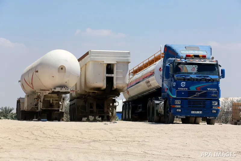 Trucks loaded with cooking gas imported from Egypt are seen at a gas station in Rafah, in the southern Gaza Strip August 6, 2018. Egypt has allowed domestic gas deliveries into the blockaded Gaza Strip for the first time...