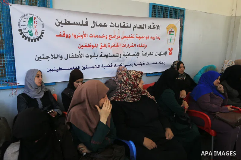 Palestinian employees of United Nations Relief and Works Agency (UNRWA) take part in a protest against a U.S. decision to cut aid, inside its offices, in Gaza City, on Aug. 07 2018. Photo by Mahmoud Khattab