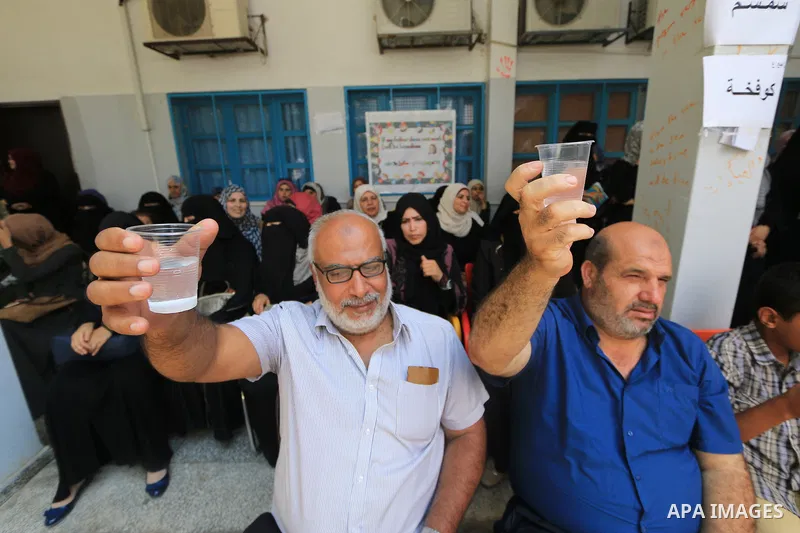Palestinian employees of United Nations Relief and Works Agency (UNRWA) take part in a protest against a U.S. decision to cut aid, inside its offices, in Gaza City, on Aug. 07 2018. Photo by Mahmoud Khattab