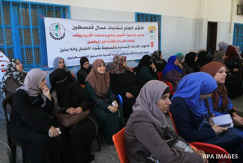 Palestinian employees of United Nations Relief and Works Agency (UNRWA) take part in a protest against a U.S. decision to cut aid, inside its offices, in Gaza City, on Aug. 07 2018. Photo by Mahmoud Khattab