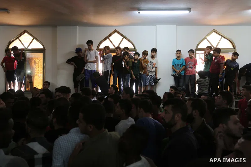 Mourners carry the body of Palestinian Hamas militant Ahmad Murjan who was killed in Israeli tank shelling, during his funeral in Jabaliya, northern Gaza Strip, August 7, 2018. Israeli forces killed two militants of Hama...