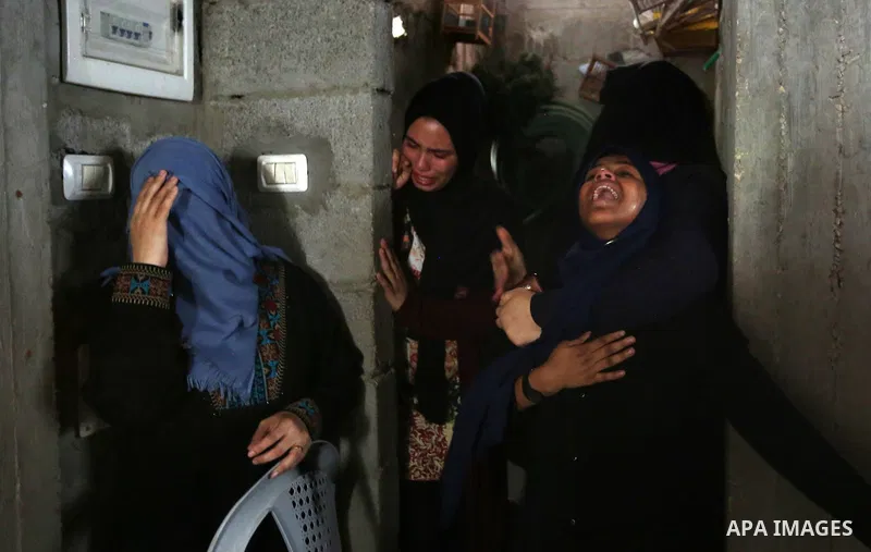 Relatives of Palestinian Hamas militant Ahmad Murjan who was killed in Israeli tank shelling, mourn during his funeral in Jabaliya, northern Gaza Strip, August 7, 2018. Israeli forces killed two militants of Hamas moveme...