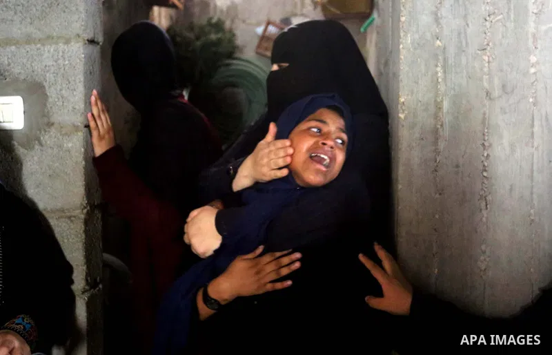 Relatives of Palestinian Hamas militant Ahmad Murjan who was killed in Israeli tank shelling, mourn during his funeral in Jabaliya, northern Gaza Strip, August 7, 2018. Israeli forces killed two militants of Hamas moveme...