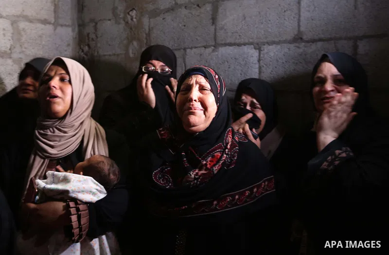 Relatives of Palestinian Hamas militant Ahmad Murjan who was killed in Israeli tank shelling, mourn during his funeral in Jabaliya, northern Gaza Strip, August 7, 2018. Israeli forces killed two militants of Hamas moveme...