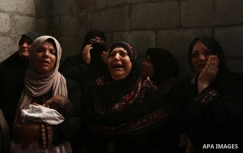 Relatives of Palestinian Hamas militant Ahmad Murjan who was killed in Israeli tank shelling, mourn during his funeral in Jabaliya, northern Gaza Strip, August 7, 2018. Israeli forces killed two militants of Hamas moveme...
