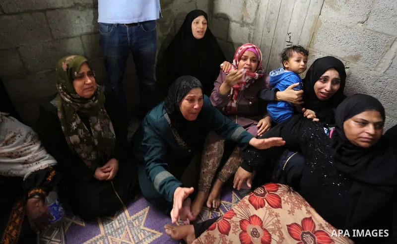 Relatives of Palestinian Hamas militant Ahmad Murjan who was killed in Israeli tank shelling, mourn during his funeral in Jabaliya, northern Gaza Strip, August 7, 2018. Israeli forces killed two militants of Hamas moveme...