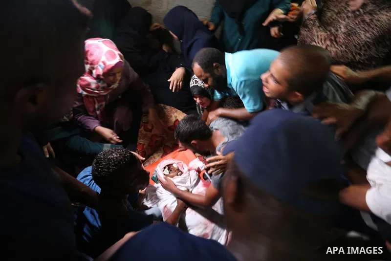 Relatives of Palestinian Hamas militant Ahmad Murjan who was killed in Israeli tank shelling, mourn during his funeral in Jabaliya, northern Gaza Strip, August 7, 2018. Israeli forces killed two militants of Hamas moveme...