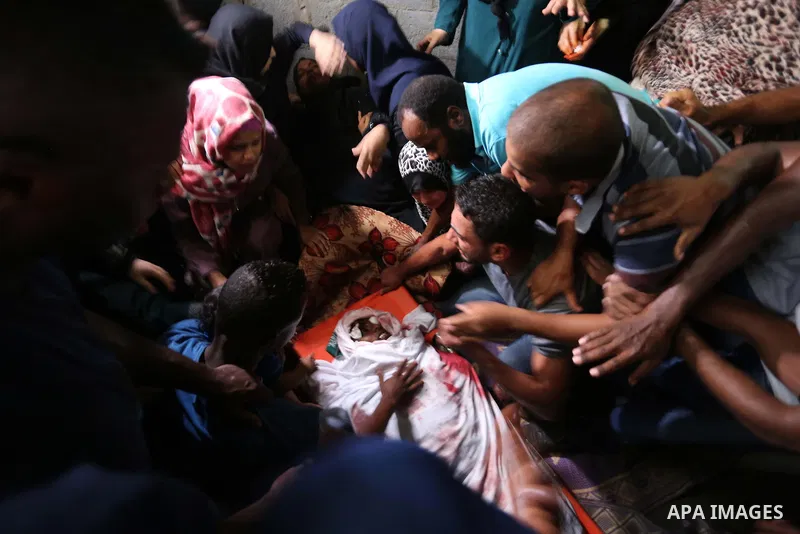 Relatives of Palestinian Hamas militant Ahmad Murjan who was killed in Israeli tank shelling, mourn during his funeral in Jabaliya, northern Gaza Strip, August 7, 2018. Israeli forces killed two militants of Hamas moveme...