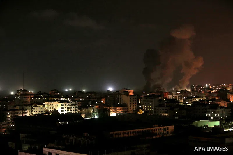 A picture taken on August 8, 2018 shows smoke plumes risisng following an Israeli air strike in Gaza City. Photo by Mahmoud Nasser