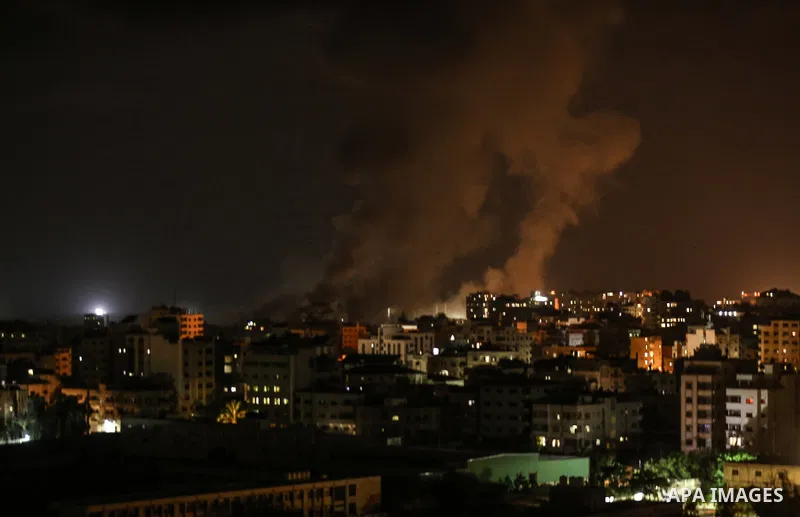 A picture taken on August 8, 2018 shows smoke plumes risisng following an Israeli air strike in Gaza City. Photo by Dawoud Abo Alkas
