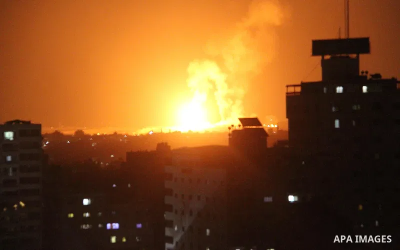 A picture taken on August 9, 2018 shows shows a fireball exploding during Israeli air strikes in Gaza City. Photo by Mahmoud Ajour