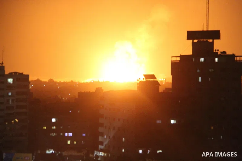 A picture taken on August 9, 2018 shows shows a fireball exploding during Israeli air strikes in Gaza City. Photo by Mahmoud Ajour