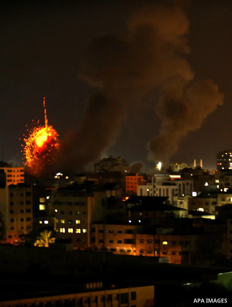 A picture taken on August 8, 2018 shows a fireball exploding during Israeli air strikes in Gaza City. Photo by Dawoud Abo Alkas