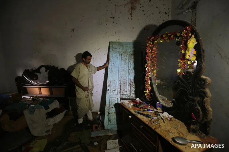 Palestinians inspect a house that was damaged in an Israeli airstrike on Dair al Balah in the center of Gaza Strip on August 9, 2018. Photo by Ashraf Amra