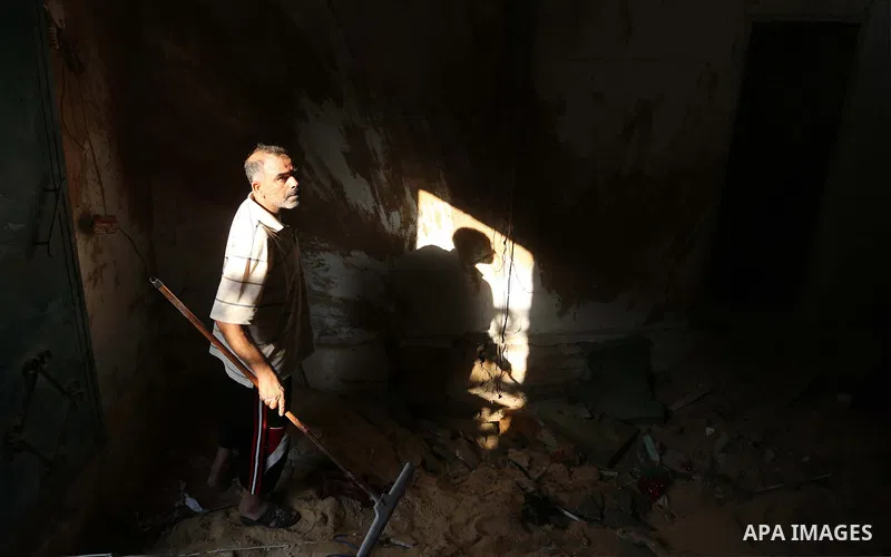 Palestinians inspect a house that was damaged in an Israeli airstrike on Dair al Balah in the center of Gaza Strip on August 9, 2018. Photo by Ashraf Amra