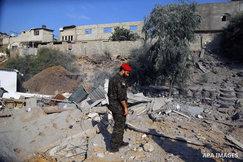 Palestinian Members of Hamas' military police inspect a site damaged in an Israeli airstrike in Gaza City on August 9, 2018. Photo by Dawoud Abo Alkas