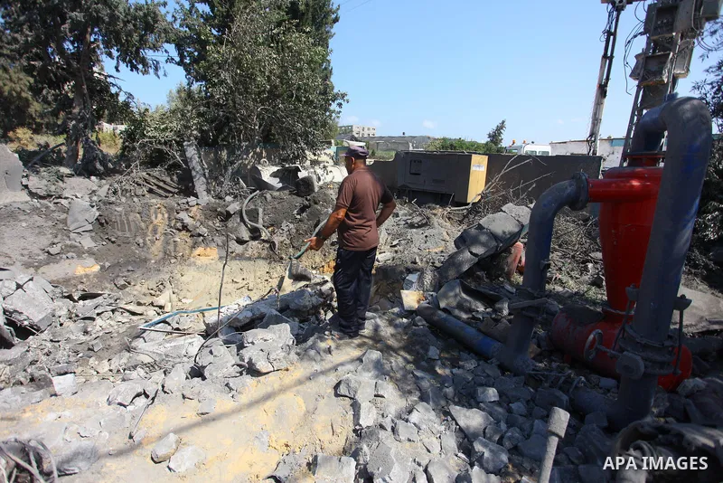 Palestinians inspect a site that was damaged in an Israeli airstrike in Beit Lahia, in the northern of Gaza Strip on August 9, 2018. Photo by Mahmoud Ajour