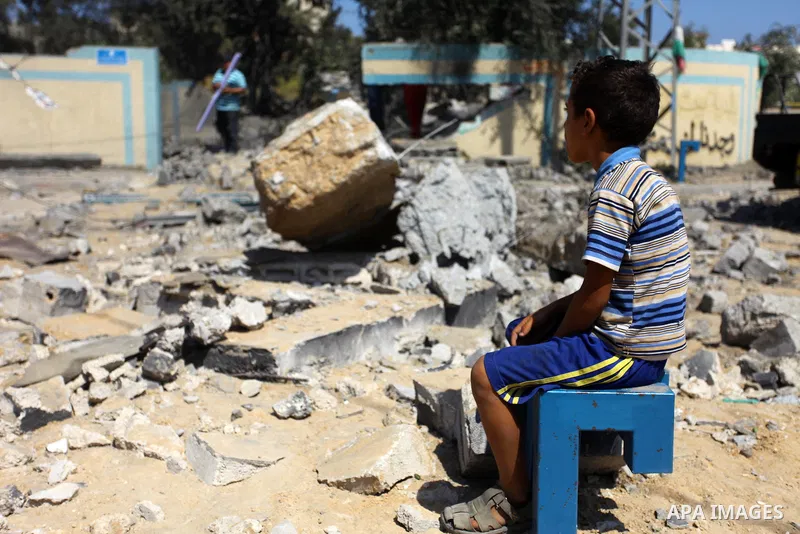 Palestinians inspect a site that was damaged in an Israeli airstrike in Beit Lahia, in the northern of Gaza Strip on August 9, 2018. Photo by Mahmoud Ajour