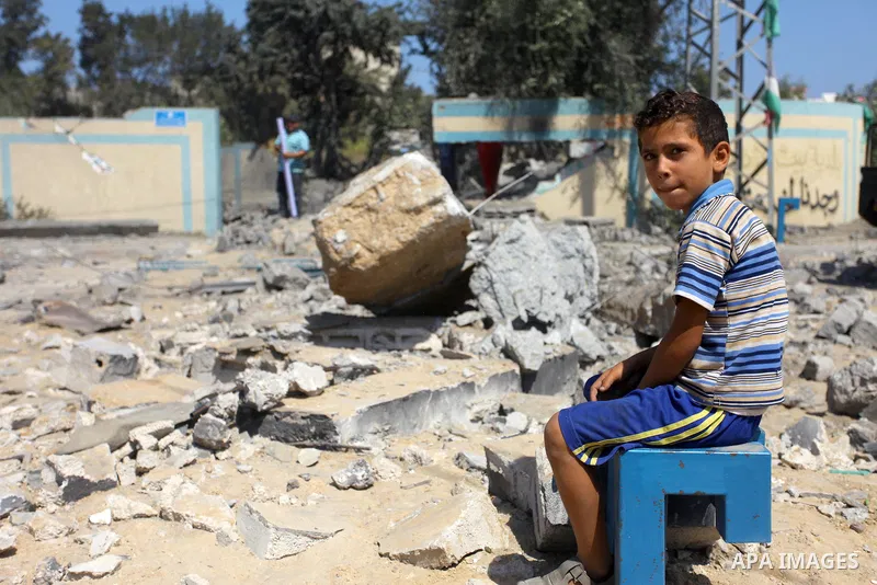 Palestinians inspect a site that was damaged in an Israeli airstrike in Beit Lahia, in the northern of Gaza Strip on August 9, 2018. Photo by Mahmoud Ajour