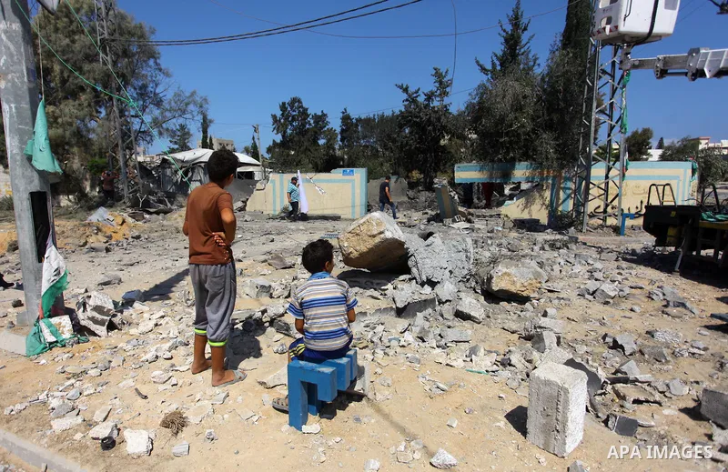 Palestinians inspect a site that was damaged in an Israeli airstrike in Beit Lahia, in the northern of Gaza Strip on August 9, 2018. Photo by Mahmoud Ajour
