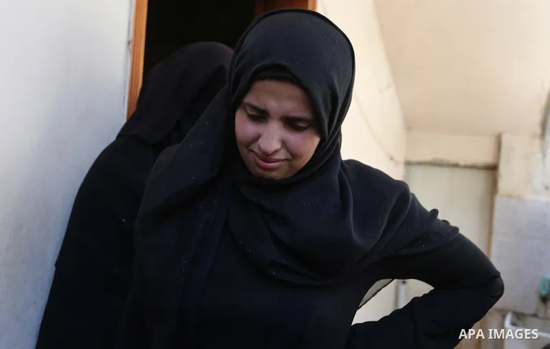 Relatives of Palestinian Enas Khammash 23, and her 18-month-daughter Bayan, mourn during their funeral in Deir Al-Balah in the central Gaza Strip on August 9, 2018, who were killed earlier in an Israeli airstrike. - The...