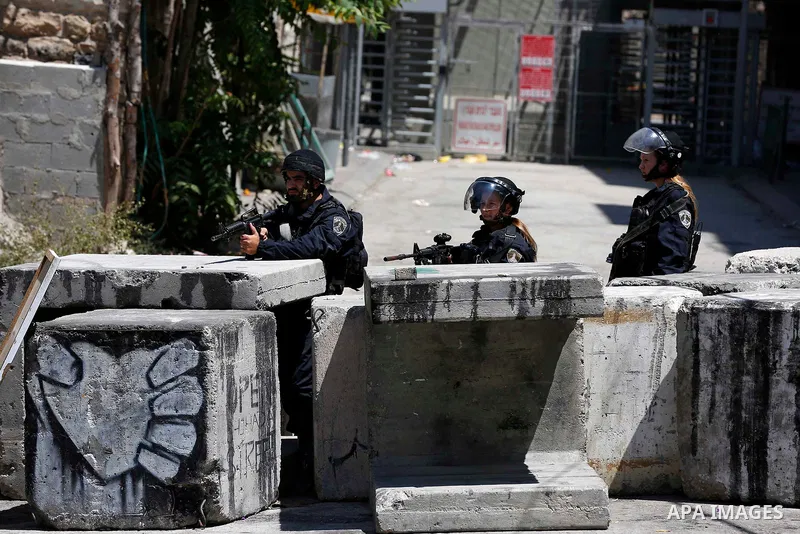Israeli soldiers take position during clashes with Palestinian protesters in the West Bank city of Hebron on Aug. 10, 2018. Photo by Wisam Hashlamoun