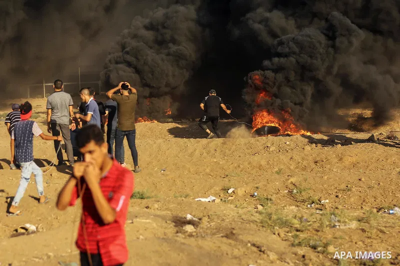 Palestinian protesters gather during clashes with Israeli troops in tents protest where Palestinian demand the right to return to their homeland at the Israel-Gaza border, in east of Gaza City on Aug. 10, 2018. Photo by...