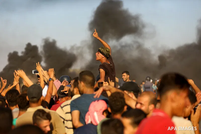 Palestinian protesters gather during clashes with Israeli troops in tents protest where Palestinian demand the right to return to their homeland at the Israel-Gaza border, in east of Gaza City on Aug. 10, 2018. Photo by...