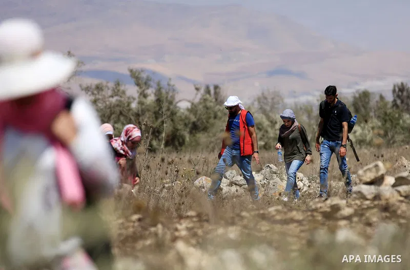 Palestinian youths participate in a tour at Asira al-Shamaliya village near the West Bank city of Nablus on Aug. 10, 2018. Photo by Shadi Jarar'ah