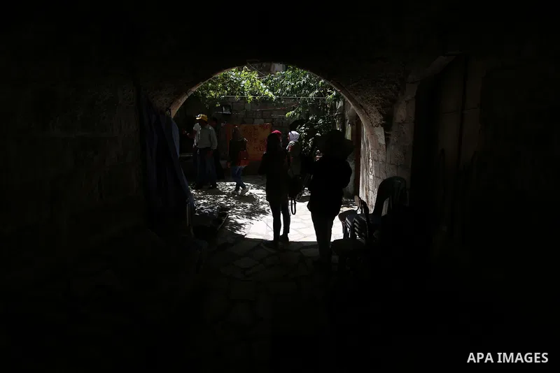 Palestinian youths participate in a tour at Asira al-Shamaliya village near the West Bank city of Nablus on Aug. 10, 2018. Photo by Shadi Jarar'ah