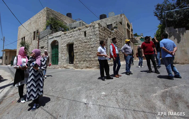 Palestinian youths participate in a tour at Asira al-Shamaliya village near the West Bank city of Nablus on Aug. 10, 2018. Photo by Shadi Jarar'ah