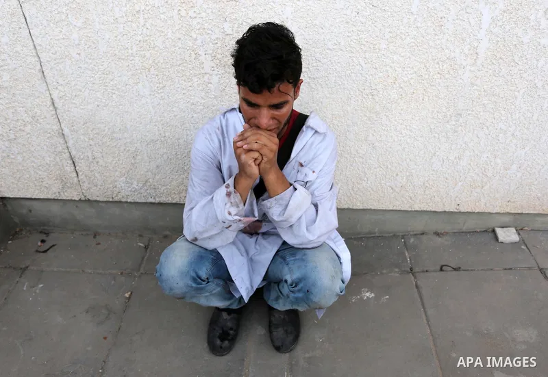 Colleagues of Palestinian medic Abdullah Al-Kotati, who was killed by Israeli troops while trying to help wounded protesters during clashes where Palestinians demand the right to return to their homeland at the Israel-Ga...