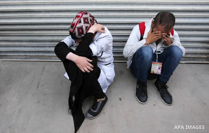Colleagues of Palestinian medic Abdullah Al-Kotati, who was killed by Israeli troops while trying to help wounded protesters during clashes where Palestinians demand the right to return to their homeland at the Israel-Ga...